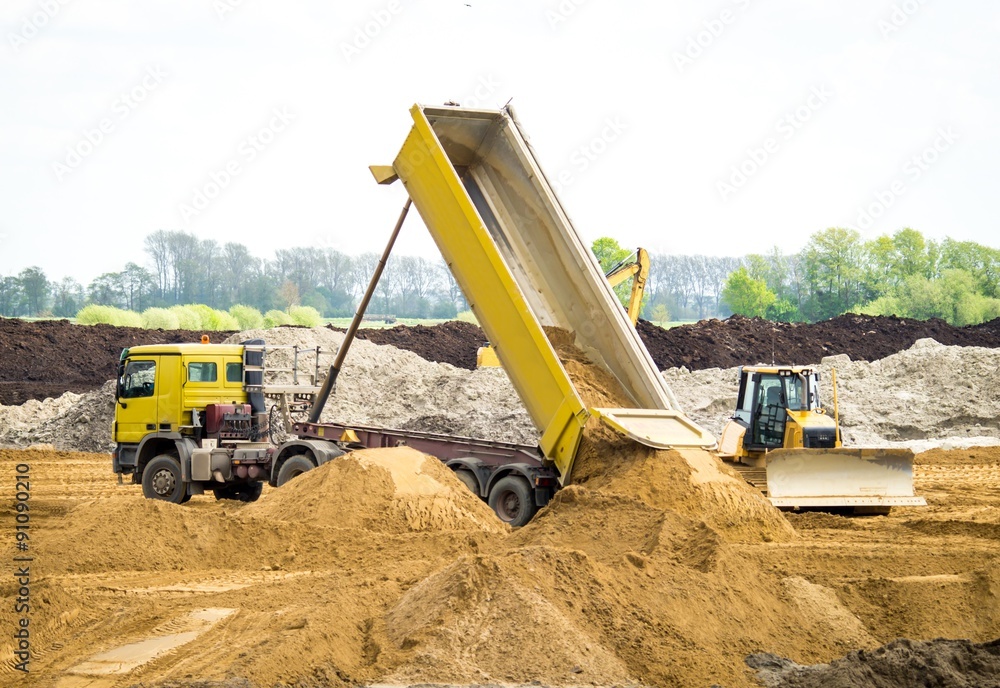 LKW beim abladen von Sand in einer Sandkuhle Stock Photo | Adobe Stock