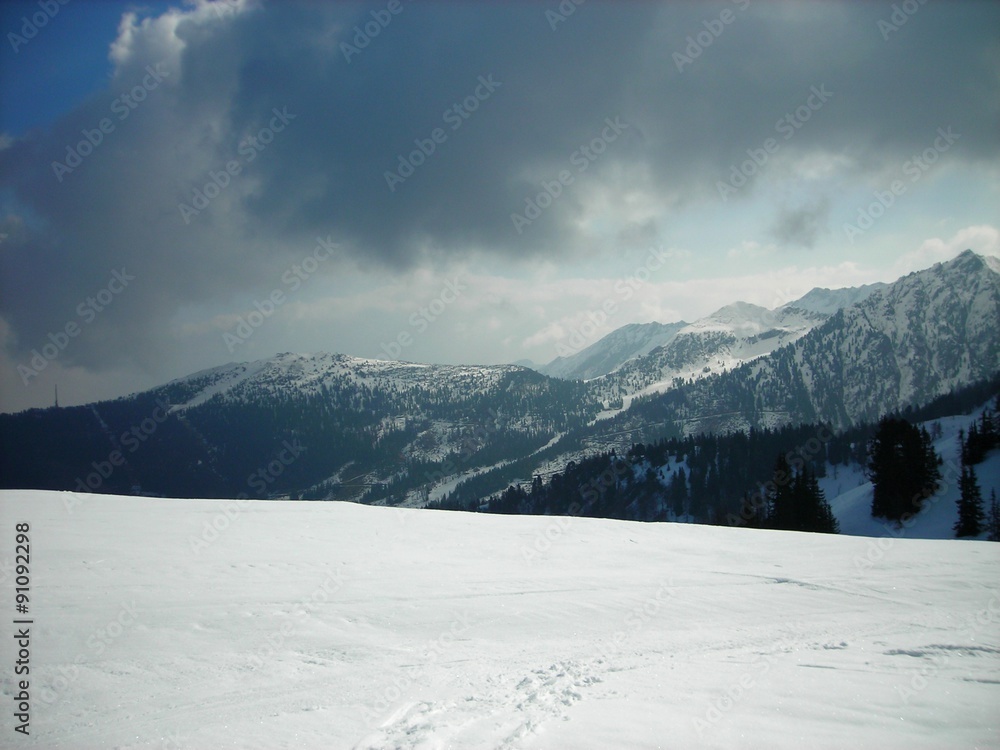 Panoramic view on the snow covered mountain tops and ski runs in the Austrian ski resort Schladming.