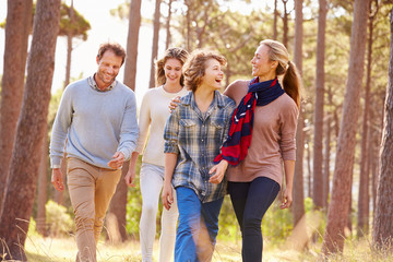 Family with teenage kids walking in the countryside