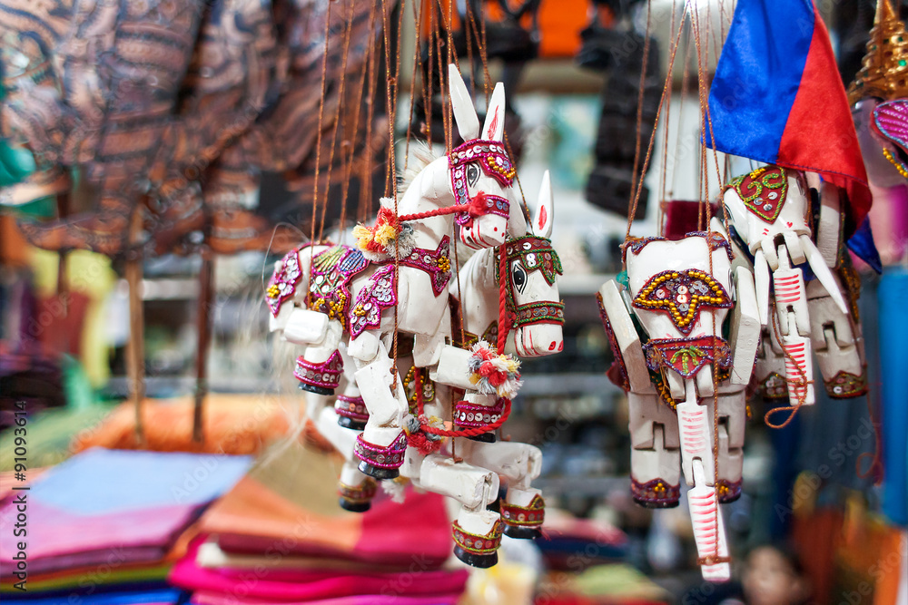 Naklejka premium Sale of souvenirs in the market, Siem Reap, Cambodia. Funny hand
