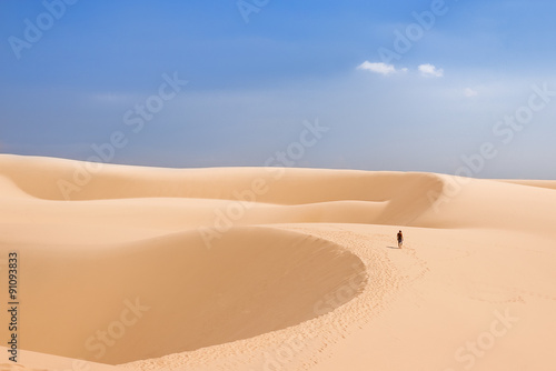 Alone man in desert. The White Dunes  bau sen  bau trang - landmark near Mui Ne  Binh Thuan  Vietnam.