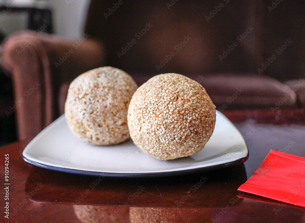 Chinese sesame balls on white plate Chinese sesame balls on white plate