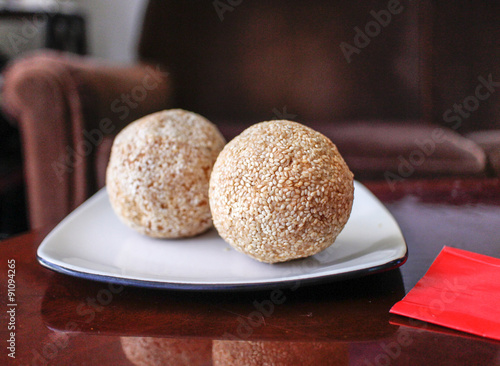 Chinese sesame balls on white plate