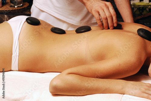 Hot stone massage in spa salon