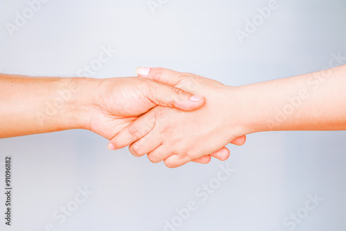 Two people hands holding together mean begin for relationship