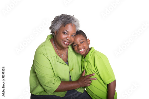 A grandmother and her grandson isolated on white