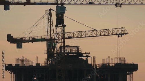 Workers On Top Of Building Under Construction