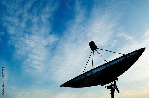Fototapeta Naklejka Na Ścianę i Meble -  Satellite dish transmission data on blue sky background