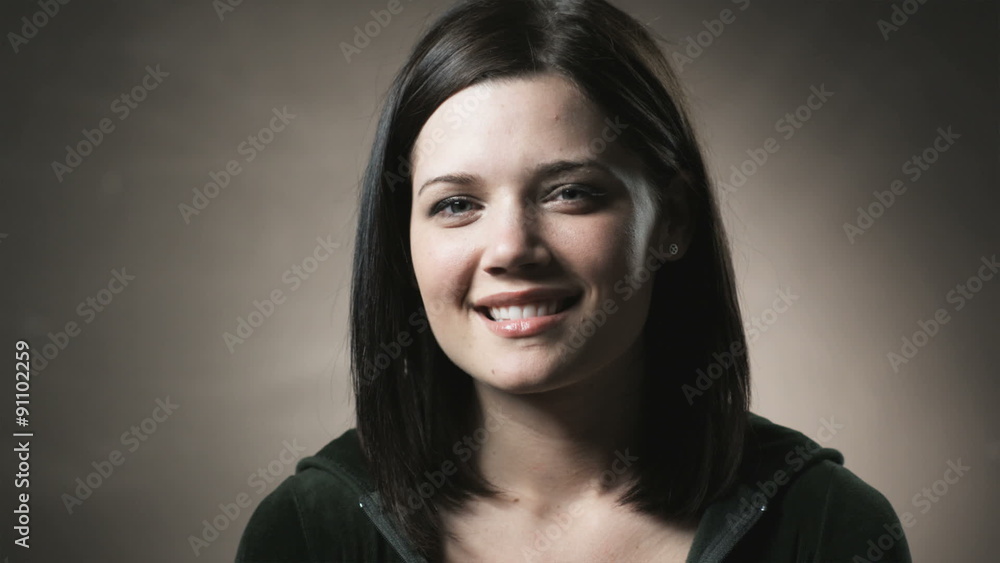 woman looking at the camera and smiling woman looking at the camera and smiling