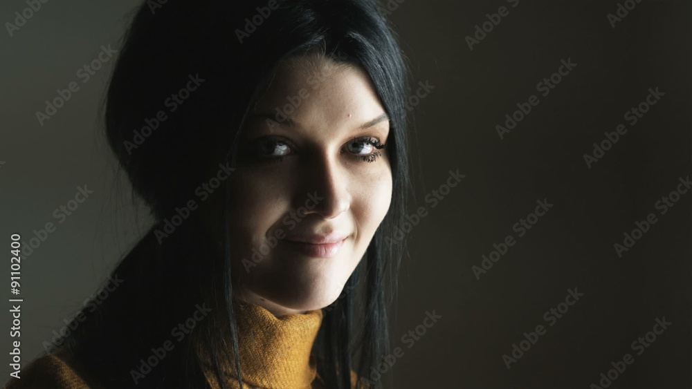woman looking at the camera and smiling woman looking at the camera and smiling