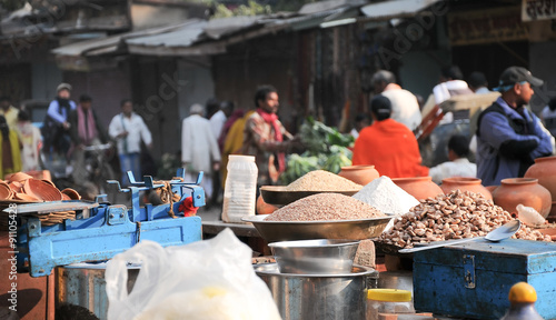 Indian colored spices at local market. Small shops like this are the most common in poor region of Delhi. Tourists can see the color of India in them.