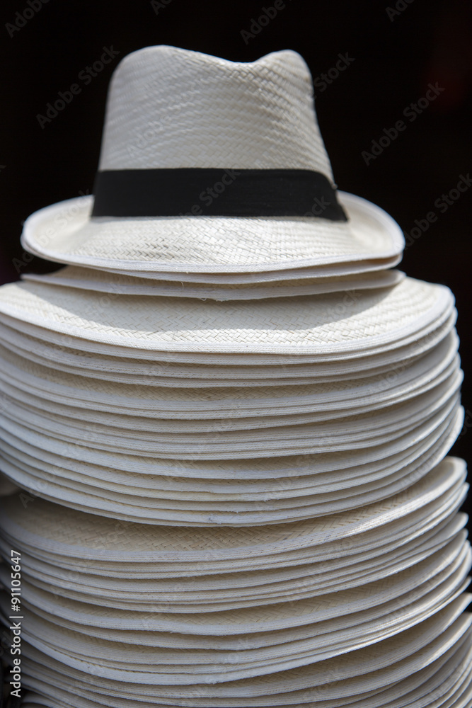 Pile of white hats stacked in tourist shop, Guatape, Colombia