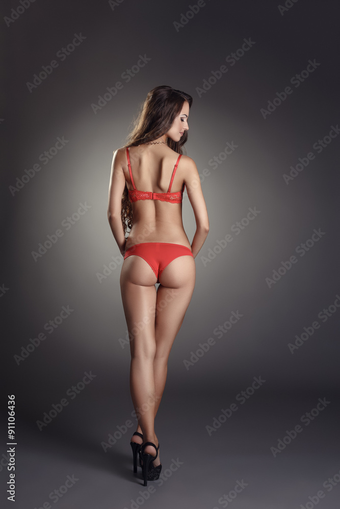 Obraz premium Romantic model posing in red sexy lingerie