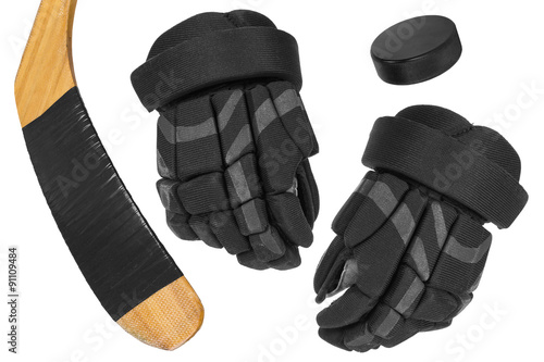 Hockey gloves, stick and puck