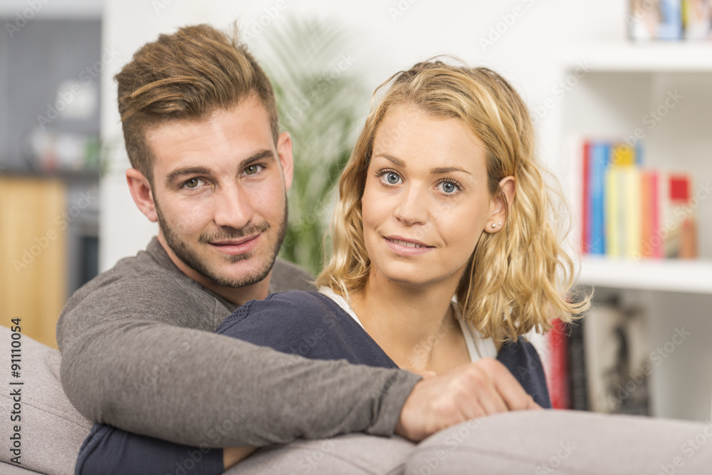 cheerful couple relaxing in sofa at home cheerful couple relaxing in sofa at home