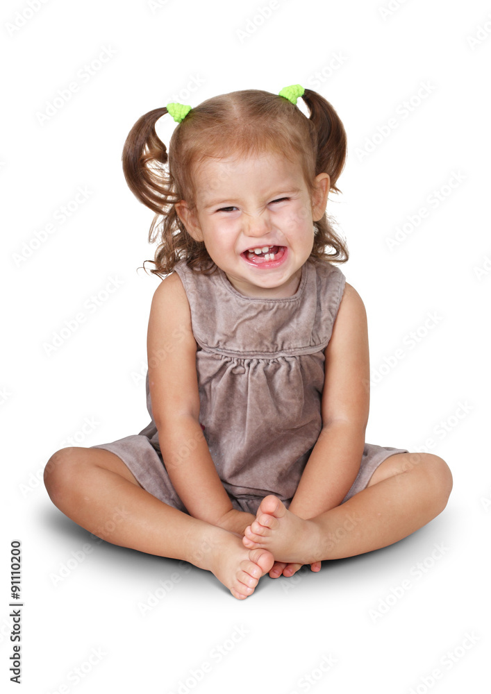 Portrait of sitting angry child girl with grin isolated on white Portrait of sitting angry child girl with grin isolated on white