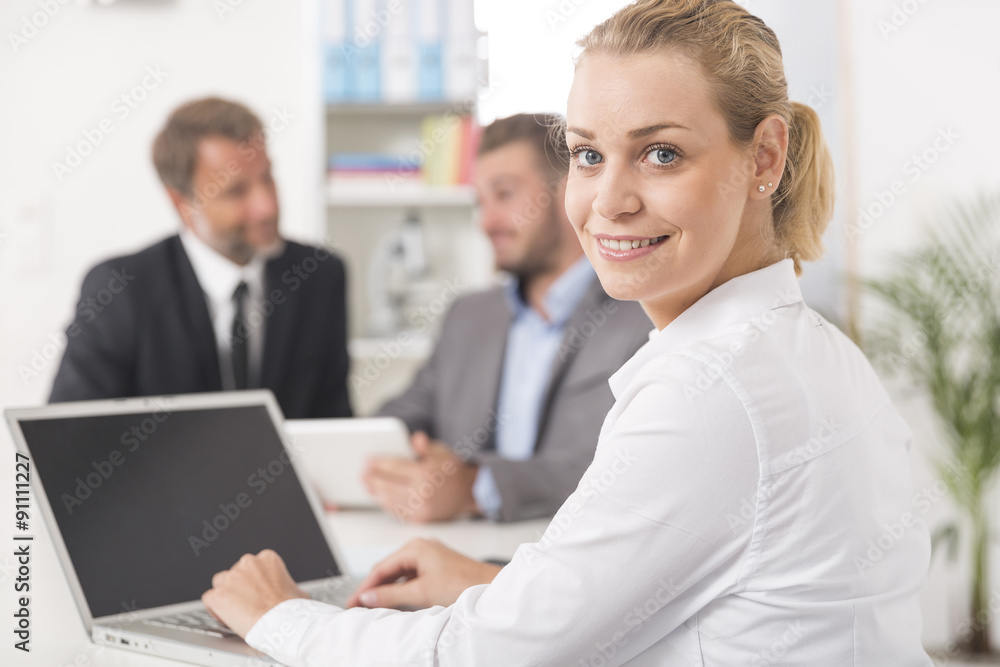 Smiling attratives businesswoman attending meeting Smiling attratives businesswoman attending meeting