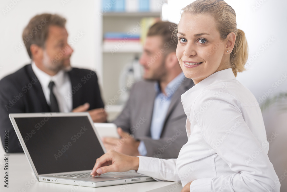 Smiling attratives businesswoman attending meeting Smiling attratives businesswoman attending meeting