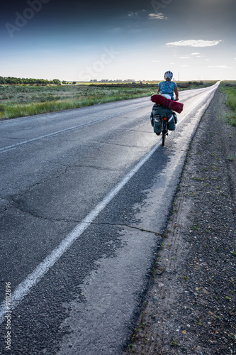 Fototapeta Naklejka Na Ścianę i Meble -  The Bicycle rider on the road.