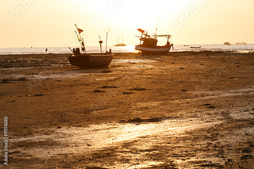 Sunsets and siluate boat photo