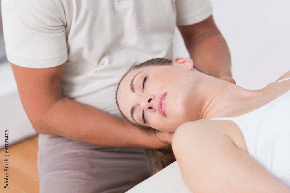 Woman receiving neck massage Woman receiving neck massage