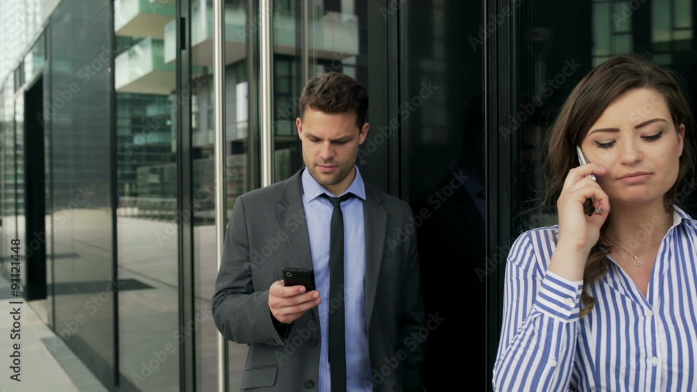 Businesspeople standing next to each other and using smartphones, steadycam shot
Businesspeople standing next to each other and using smartphones, steadycam shot