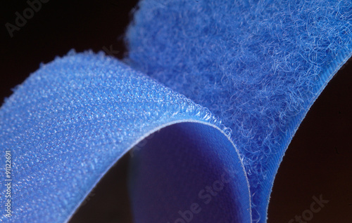 Hook-and-loop fastener aka Velcro in closeup, isolated on black photo