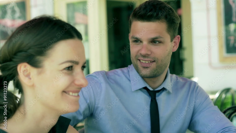 Couple relaxing in the cafe and talking with someone, steadycam shot
Couple relaxing in the cafe and talking with someone, steadycam shot
