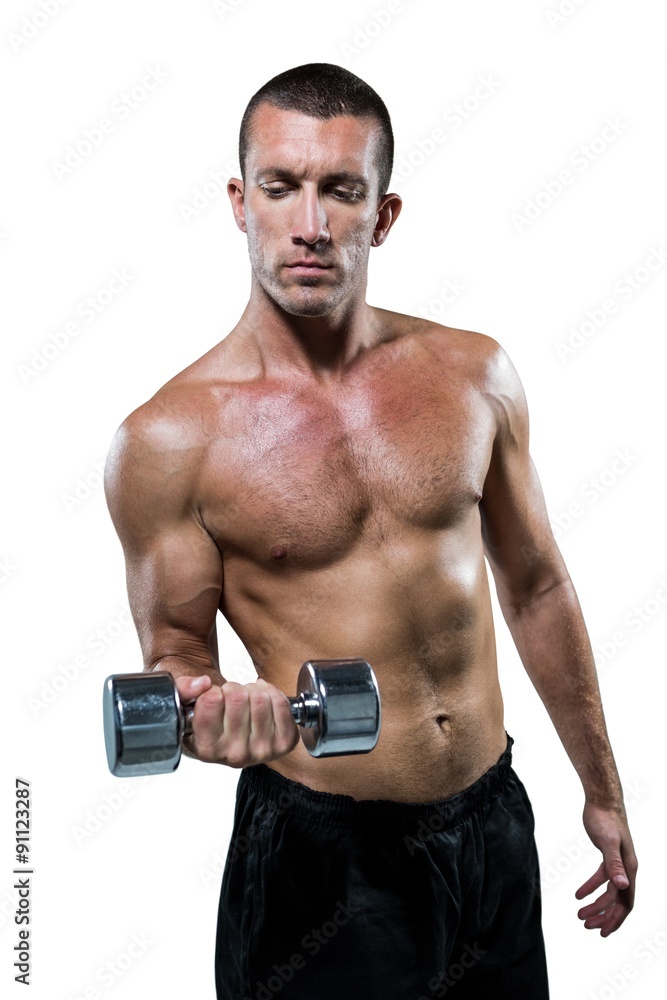 Confident shirtless athlete working out with dumbbell