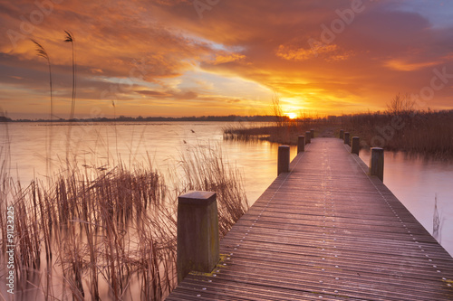 Boardwalk over water at sunrise, near Amsterdam The Netherlands