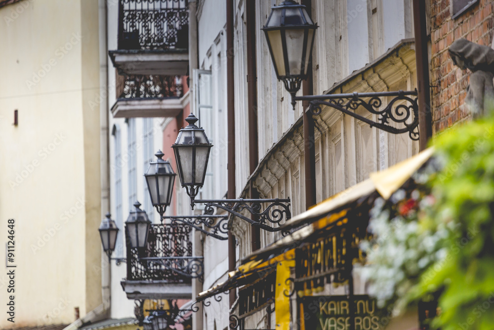 Lamp-street in the narrow street in Riga, Latvia. Lamp-street in the narrow street in Riga, Latvia.