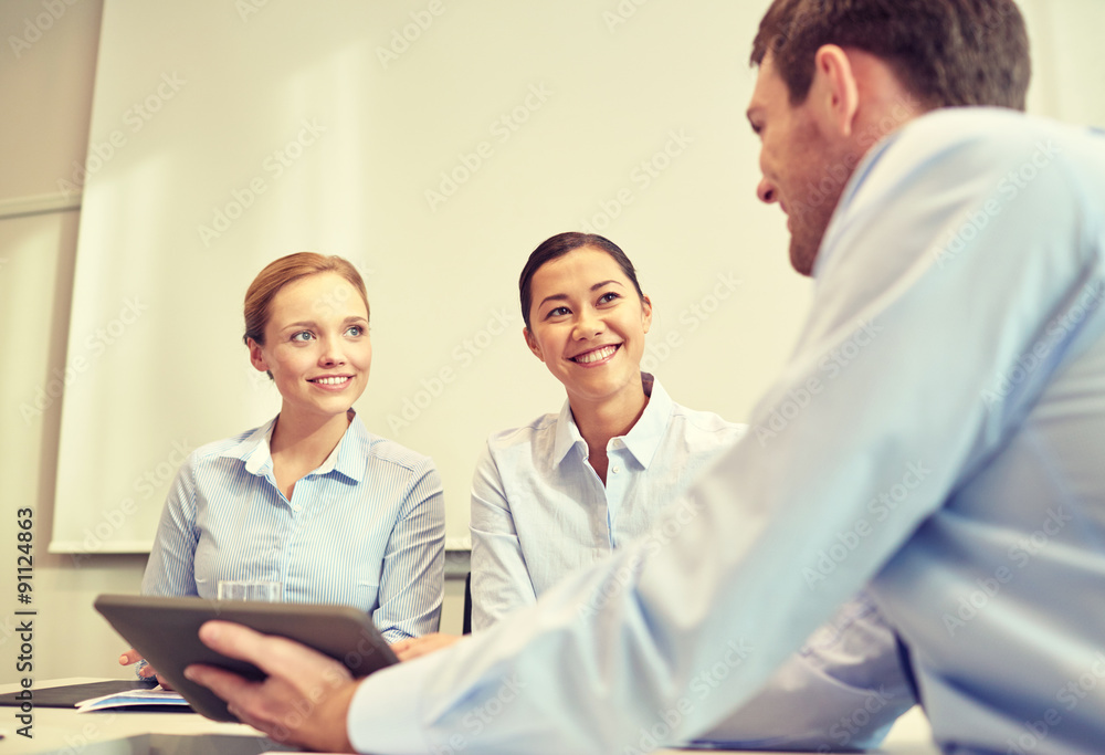 smiling businesspeople with tablet pc in office smiling businesspeople with tablet pc in office