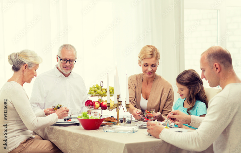 smiling family having holiday dinner at home