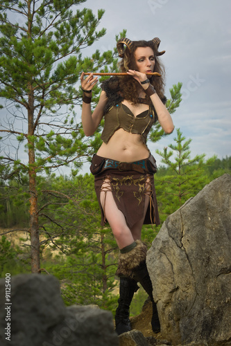 Obraz na plátne Pretty female faun playing flute
