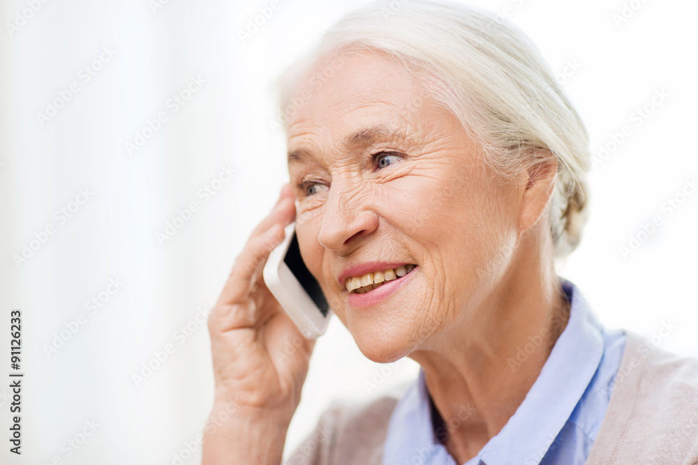 senior woman with smartphone calling at home senior woman with smartphone calling at home
