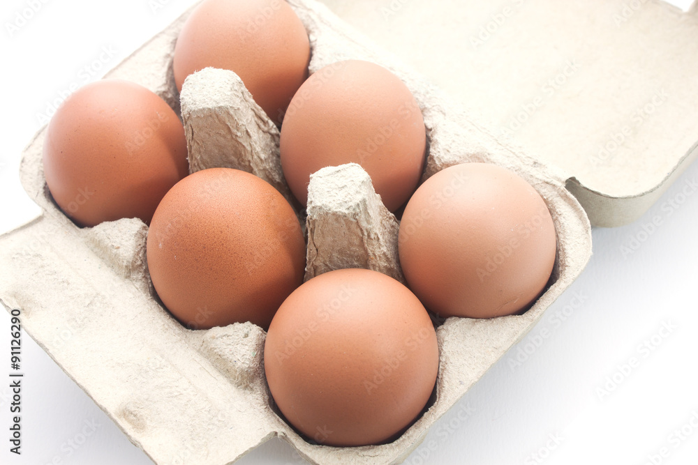 Brown eggs in packing for eggs isolated on white background Brown eggs in packing for eggs isolated on white background