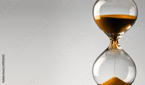 Time passing. Orange hourglass.