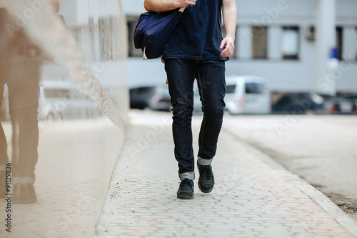 Confident man posing in selvedge  jeans photo