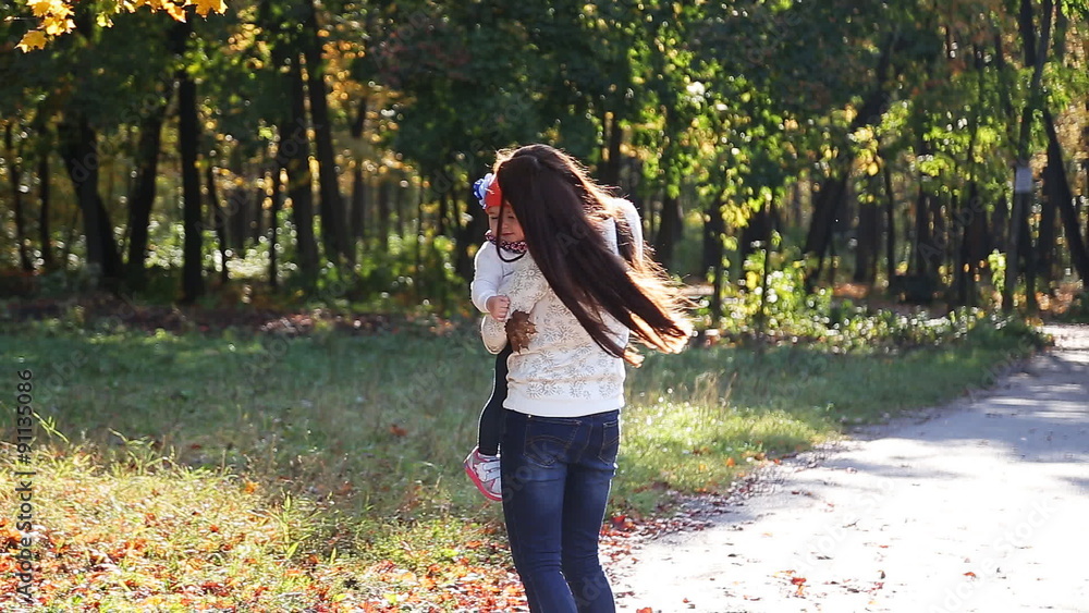 Mom and baby daughter for a walk in the autumn Mom and baby daughter for a walk in the autumn