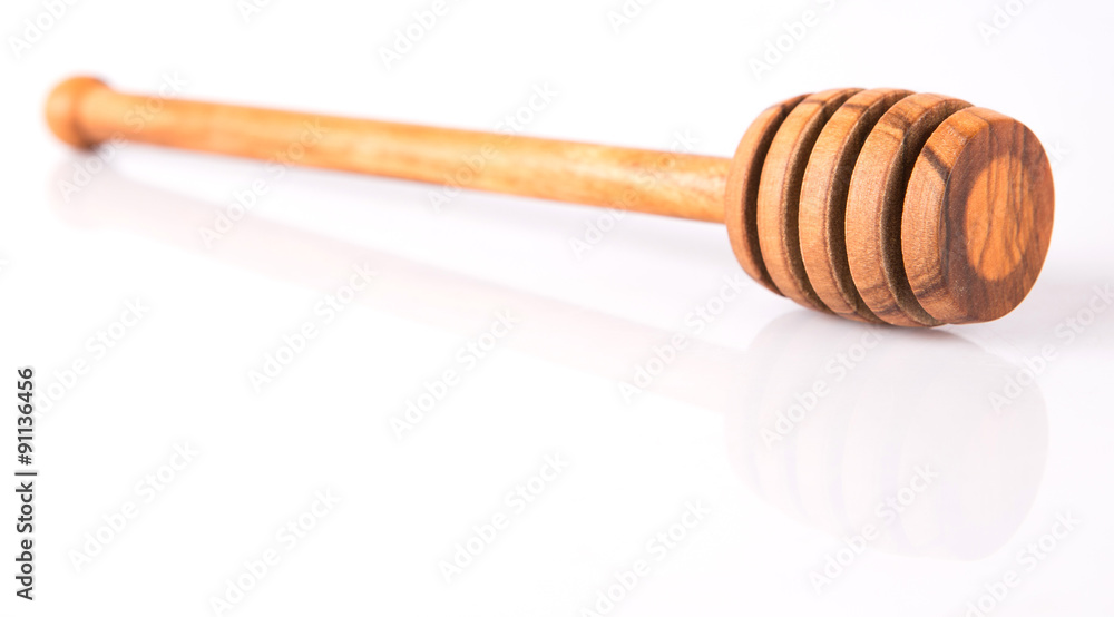 Wooden honey dipper over white background Wooden honey dipper over white background