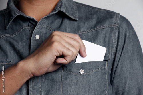 man holding a blank card photo