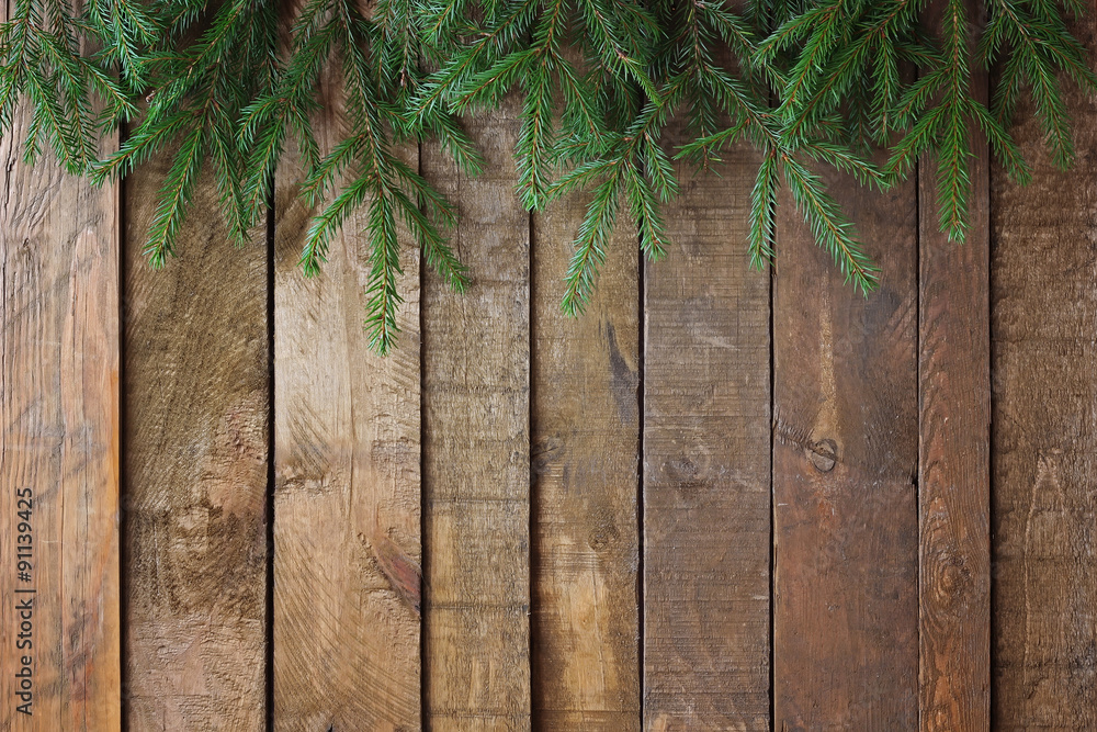 Background from boards with fir-tree branches from above Background from boards with fir-tree branches from above
