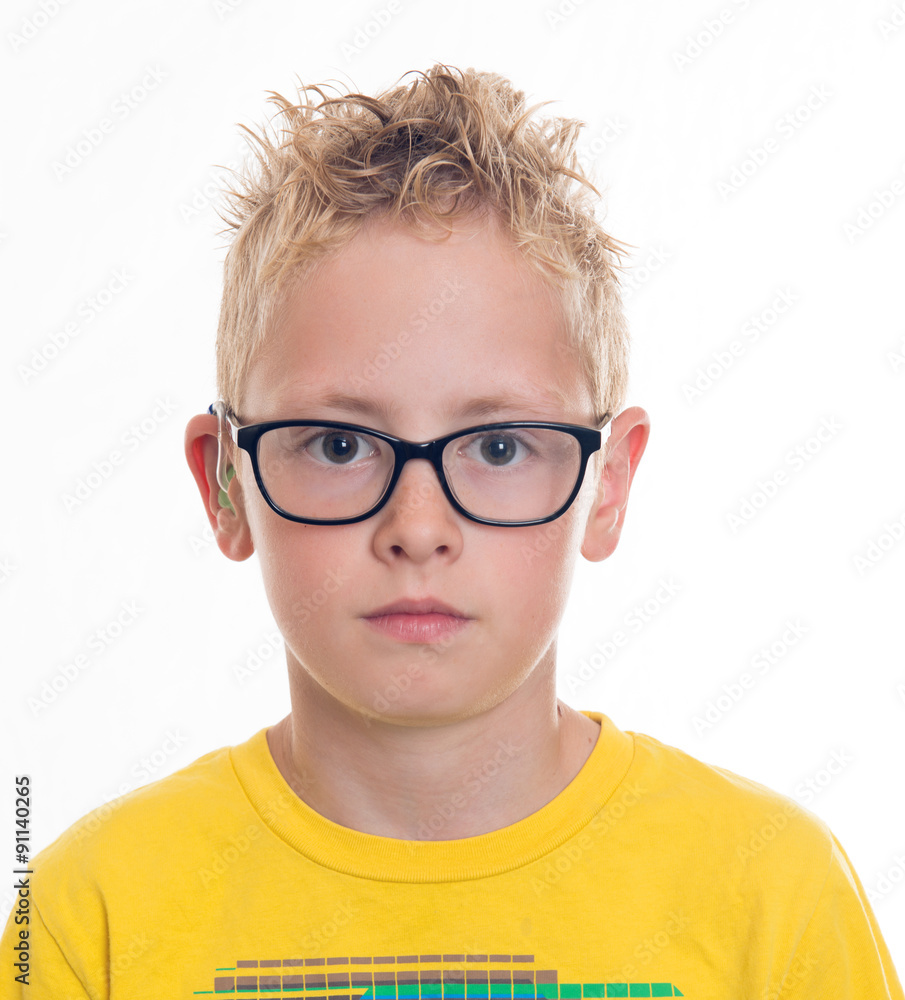 boy with hearing aid and glasses