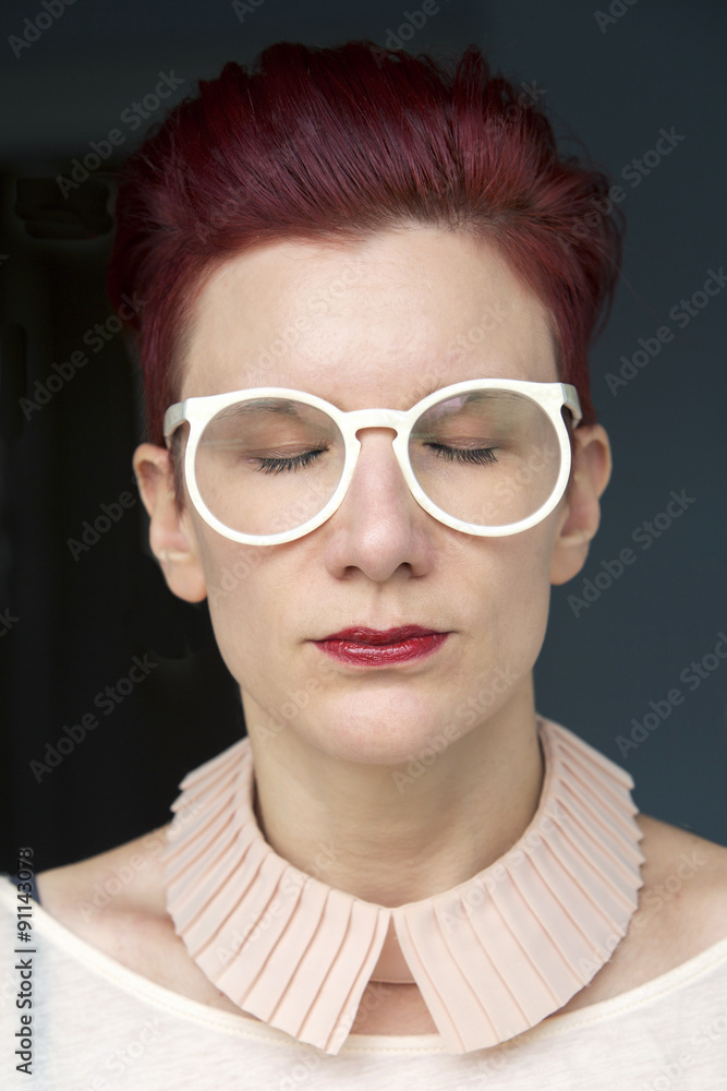 portrait of red-haired woman with eyes closed portrait of red-haired woman with eyes closed