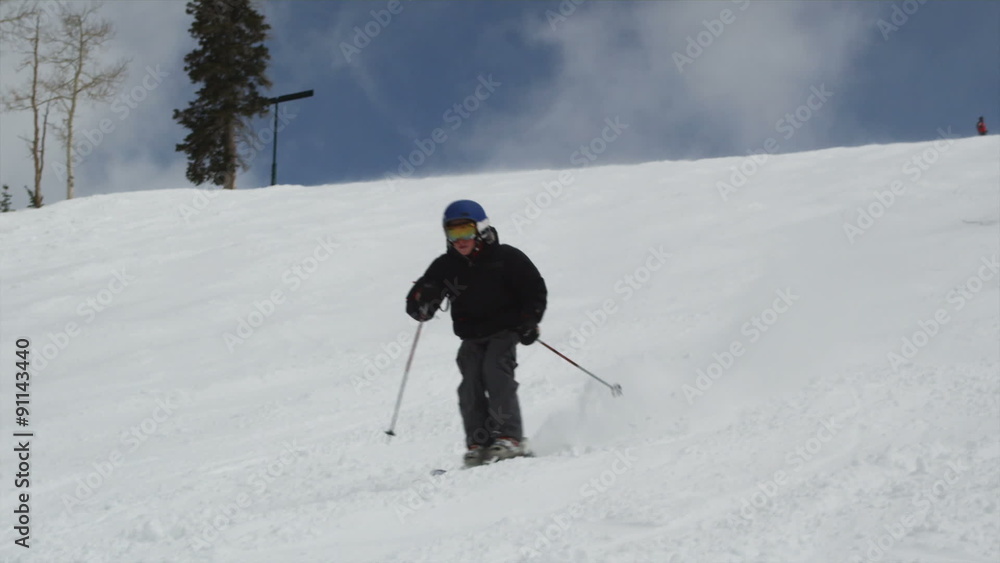 skiers skiing down the slopes at a ski resort skiers skiing down the slopes at a ski resort