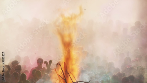flames shooting into the air from a pyre at a Hindu festival