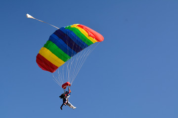 Fotobehang Luchtsport Parachutespringers in vrije val  © MacDonald