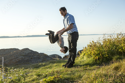 Father with is son at the sunset photo