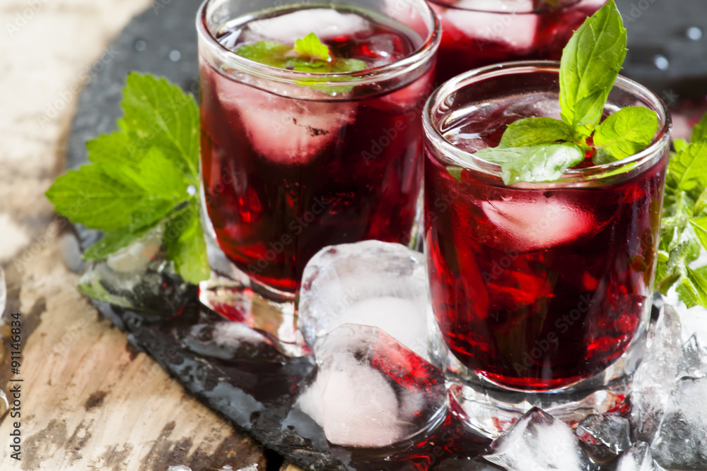 Pomegranate drink with mint and ice, selective focus Pomegranate drink with mint and ice, selective focus