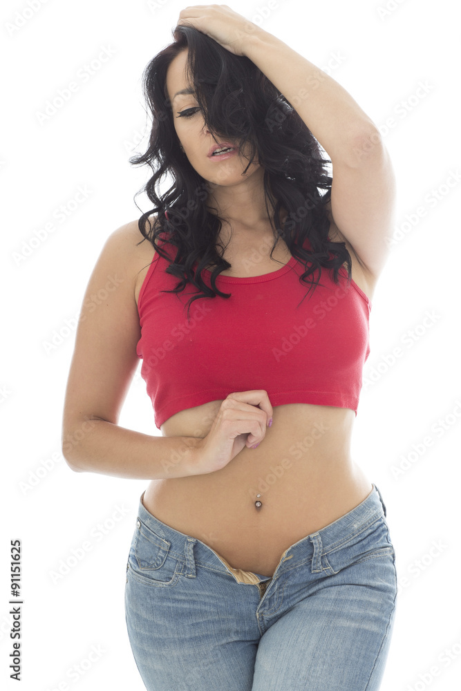 Attractive Young Hispanic Woman Posing Pin Up In Jeans and a Red Attractive Young Hispanic Woman Posing Pin Up In Jeans and a Red